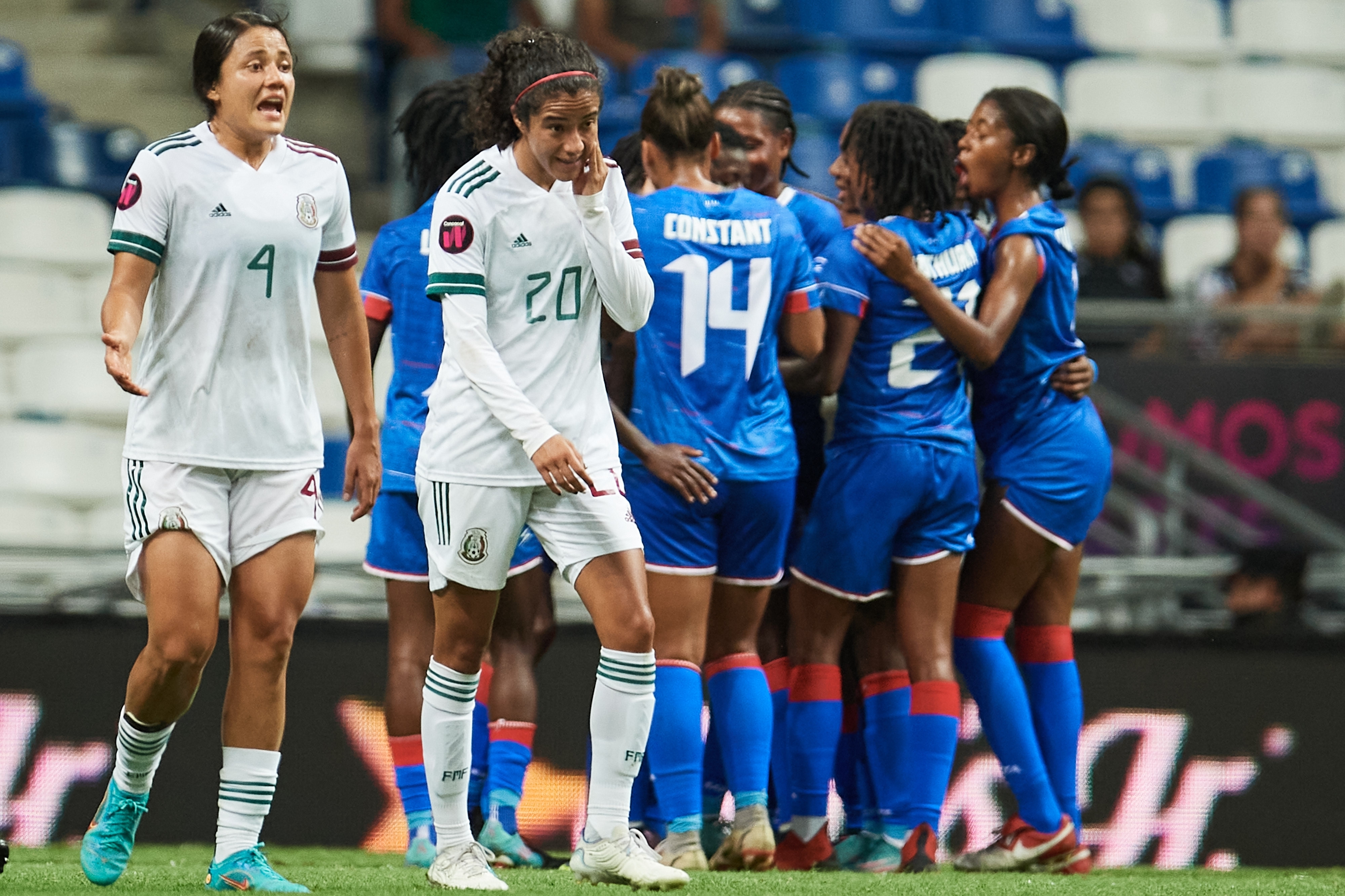 Claire Constant and her teammates from Haiti celebrate after scoring against Mexico at Estadio BBVA Bancomer on July 7, 2022.