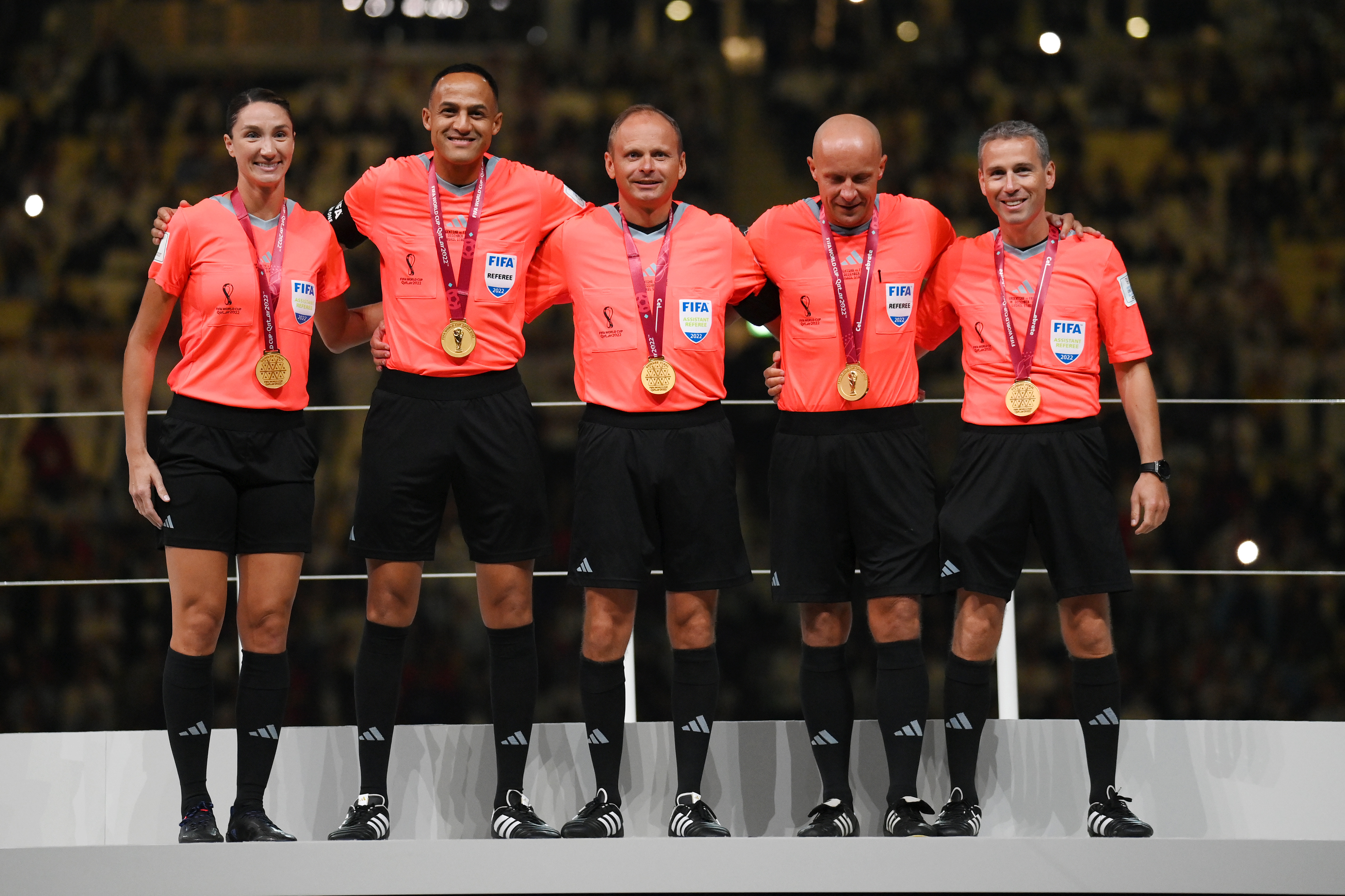 Match officials pose for a photo during the awards ceremony after the FIFA World Cup Qatar 2022 Final match between Argentina and France at Lusail Stadium on December 18, 2022 in Lusail City, Qatar.